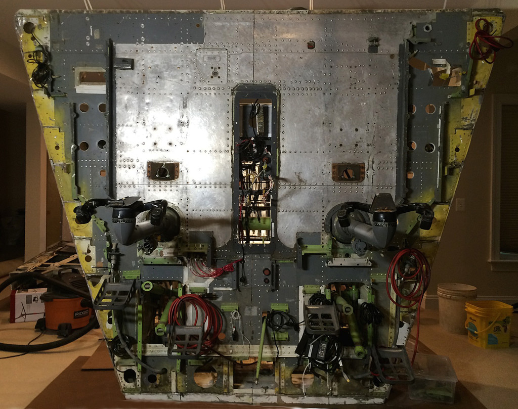 The floor section just prior to flipping back to horizontal. Various cable bundles are visible for connection to components above the floor. Kill switches for dynamic control loading motors are seen just inboard and forward of the FO control column.